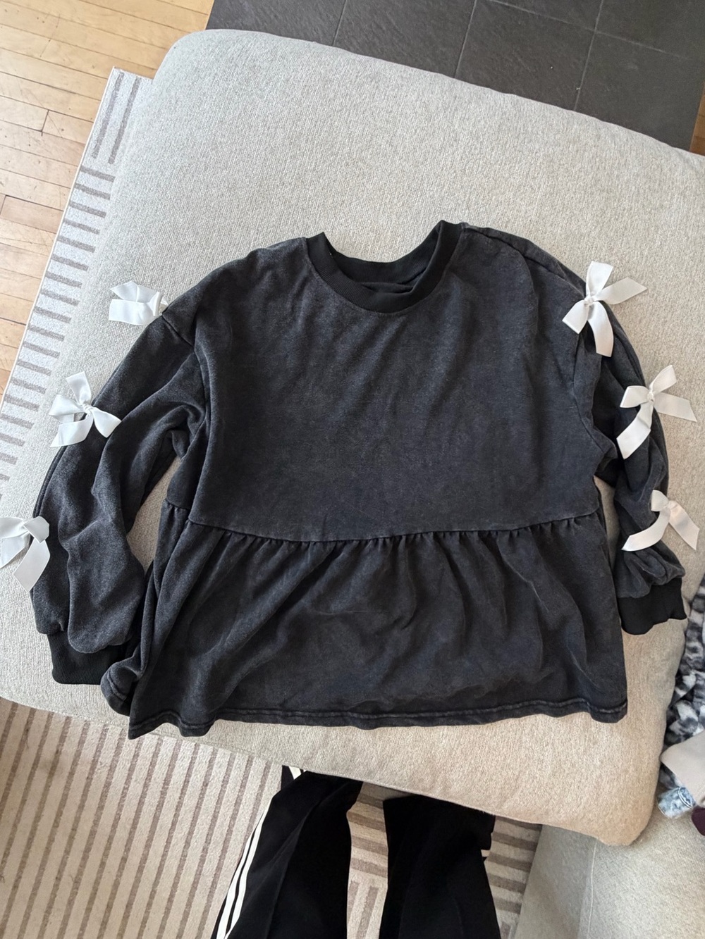 Black Long-Sleeve Peplum Top with Bow Detail